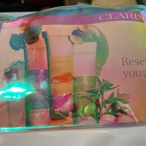 Clarins Iridescent Pouch with Travel Sized Skincare Set of 6 with Headband